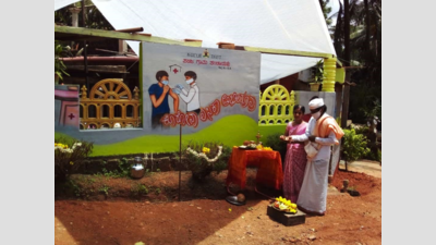 Karnataka: Social worker paints compound wall with social messages for silver wedding
