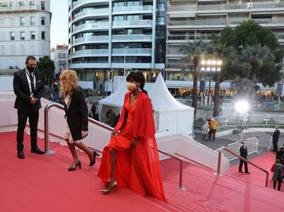 Cannes welcomes stars on a smaller red carpet