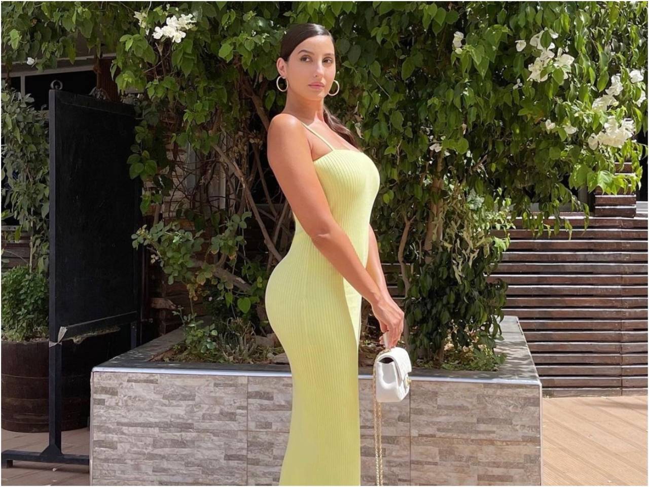 Nora Fatehi pairs sexy neon yellow bodycon dress with ₹3 lakh bag for shoot