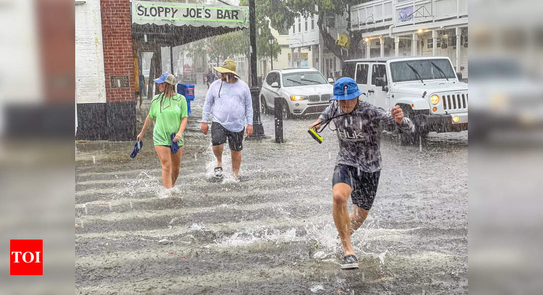 Officials: Storm lashing Florida strengthens into hurricane