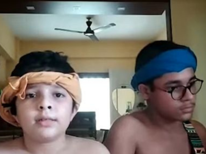 Two little boys sing Bengali version of 'Five Hundred Miles'