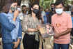 Bollywood actress Kajol distributes raincoats to BMC employees