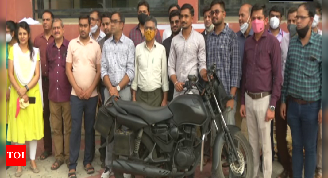 College students develop motorcycle running on electricity
