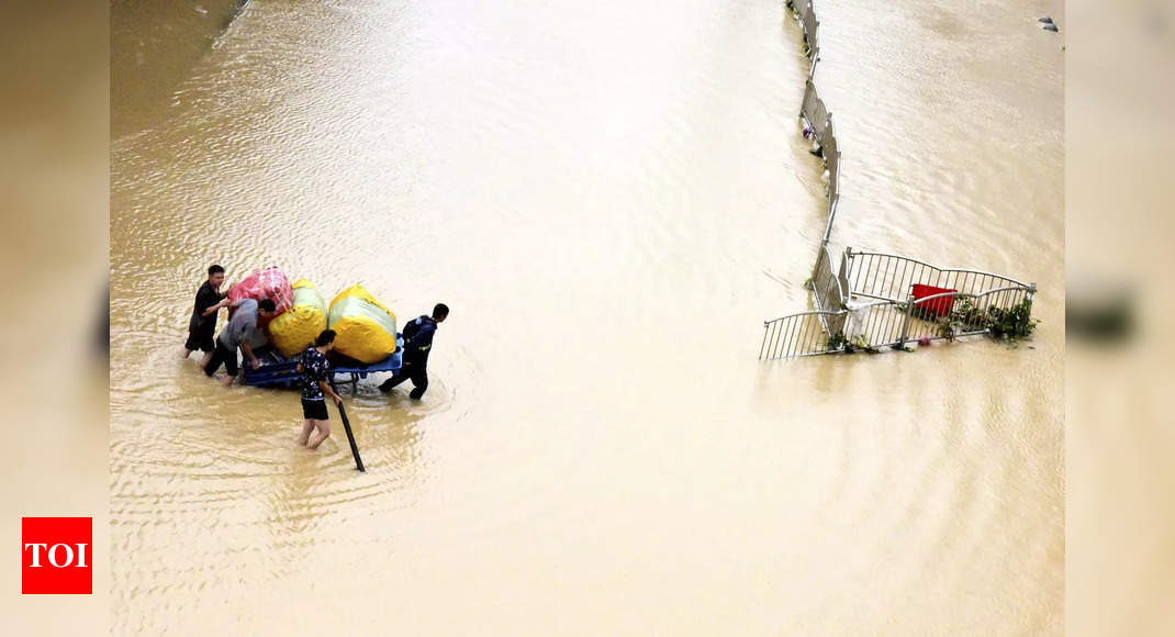 China blasts dam to divert floods that killed at least 25 – Times of India