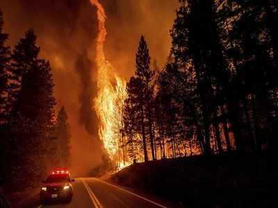 Huge California fire grows as heat spikes again across state