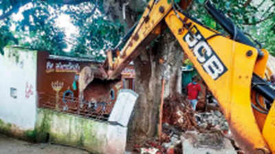 HDMC demolishes dargah and temple that encroached upon road