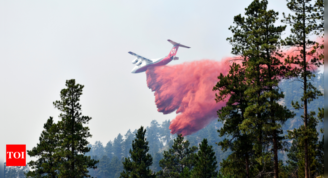 Wildfire bears down on Montana towns as West burns