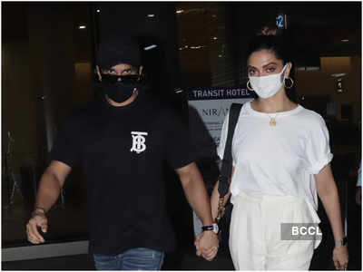 Deepika Padukone and Ranveer Singh walk hand in hand at the airport terminal