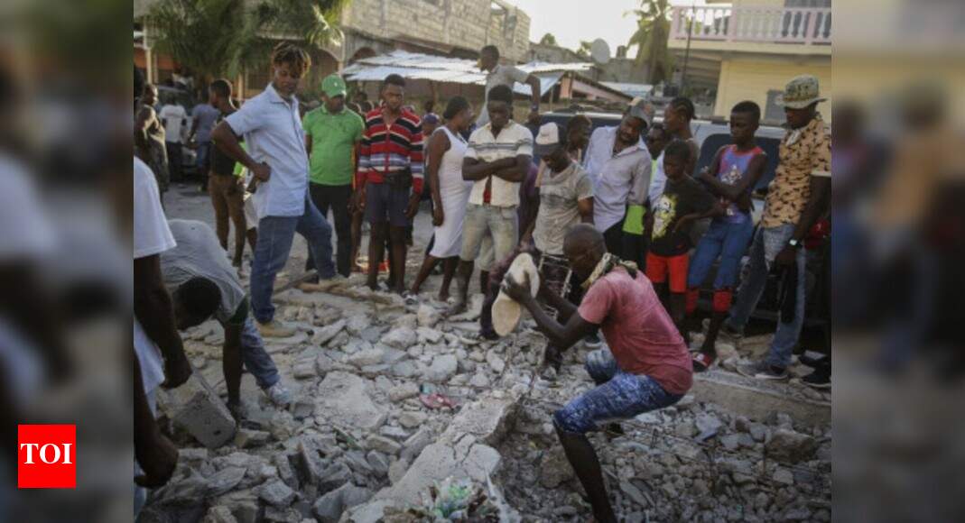 Death toll of powerful earthquake in Haiti soars to 1,297 - Times of India