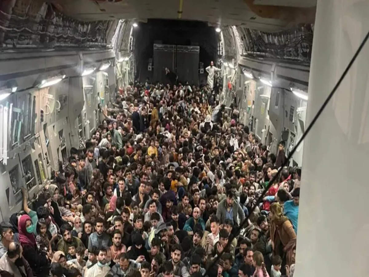 Afghanistan crisis: Striking visual shows over 600 Afghans packed inside US military plane to flee Taliban takeover - Times of India