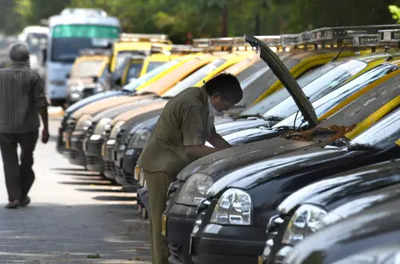 Government and auto industry czars spar over taxes, emission norms