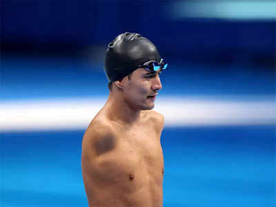 Refugee swimmer sends 'message of hope' despite missing medal