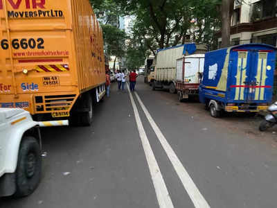 road blocked by illegal parking of trucks