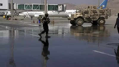 Taliban resume some flights, press assault on final holdout