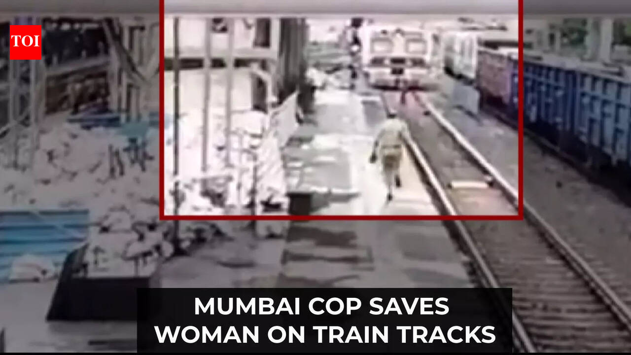 Caught on cam: Railway cop saves woman from being crushed under train ...