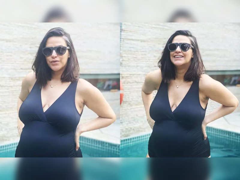 A heavily pregnant Neha Dhupia looks stunning in a black swimsuit; writes ‘Pool party for two’