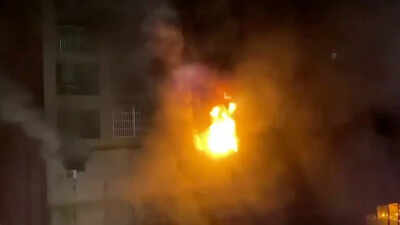 Smoke is seen as a fire blazes at Cheng Chung Cheng building in Kaohsiung, Taiwan in this still frame obtained from social media video dated early October 14, 2021 (Reuters)