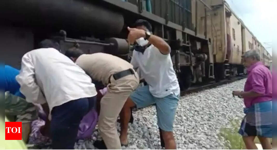 Bengaluru: RPF cop saves woman stuck under train | Bengaluru News ...