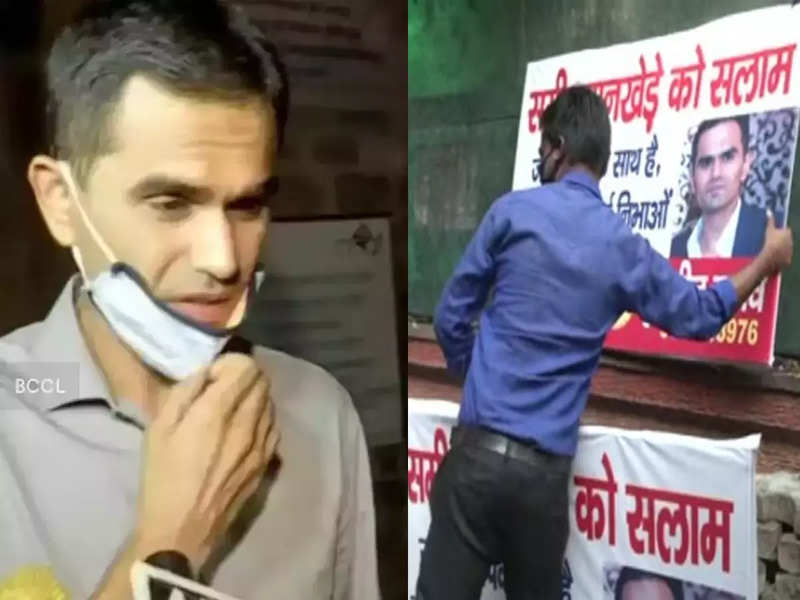 NCB officials remove poster put in support of Sameer Wankhede outside NCB office in Delhi