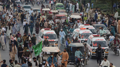 Thousands of supporters of radical Islamist party move to Islamabad to mount pressure on PM Khan