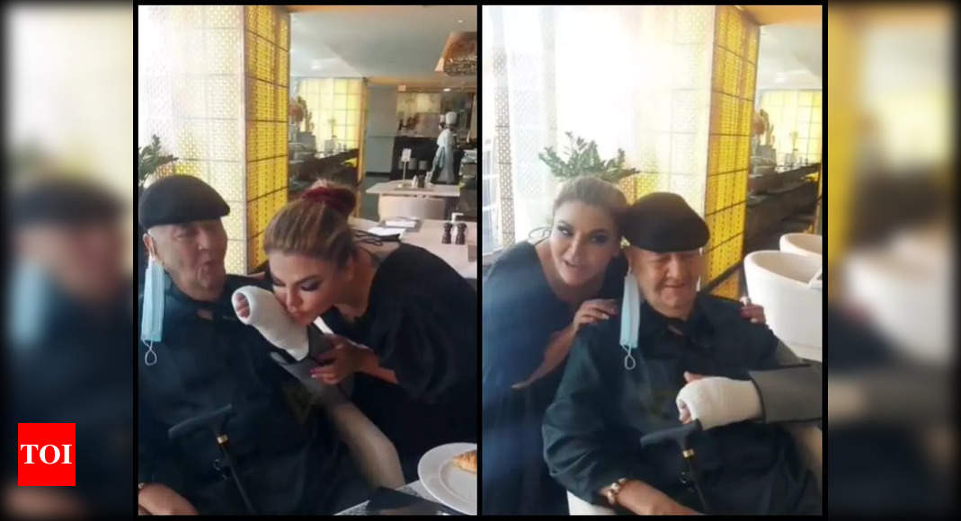 Pictures of Rakhi Sawant planting a sweet kiss on Prem Chopra's injured