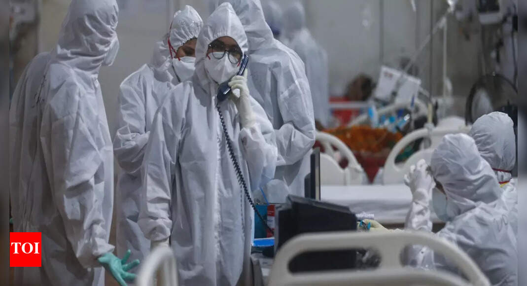 Covid-19 global death toll tops 5 million in under 2 years - Times of India