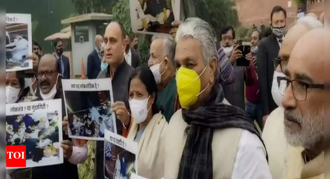 Opposition: BJP MPs protest at Parliament over 'unruly' Opposition ...