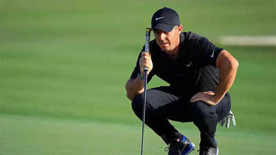 Riding a crest, McIlroy shrugs off mid-round wobble to co-lead