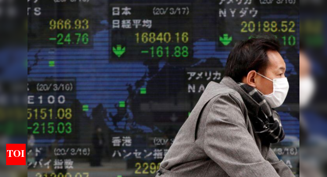 Asian shares ease as markets await U.S. inflation data - The Times of India