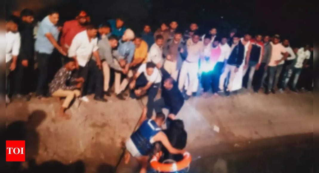 Gujarat: Miraculous escape for family from Silvassa as car swept away in Surat canal | Surat News – Times of India