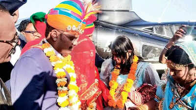 The couple being welcomed by family members in Barmer on Wednesday