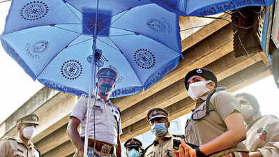 Solar umbrellas with fans to cool traffic cops in Kochi