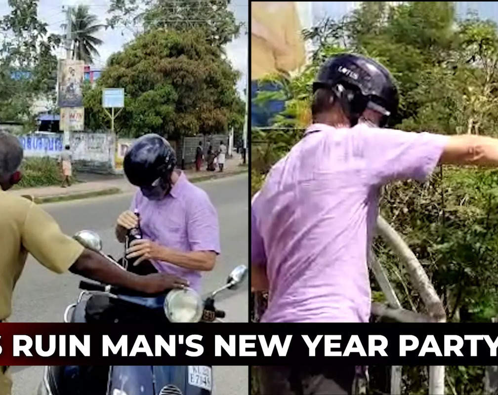 
Watch: Cops force foreigner to empty liquor bottles on road on New Year Eve
