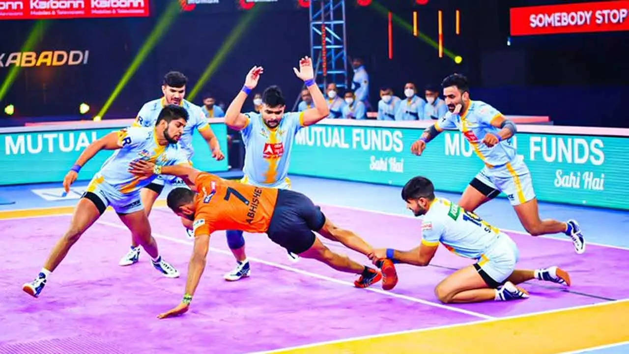 Bengaluru Bulls' players pin down a U Mumba player, Shiv Om, in