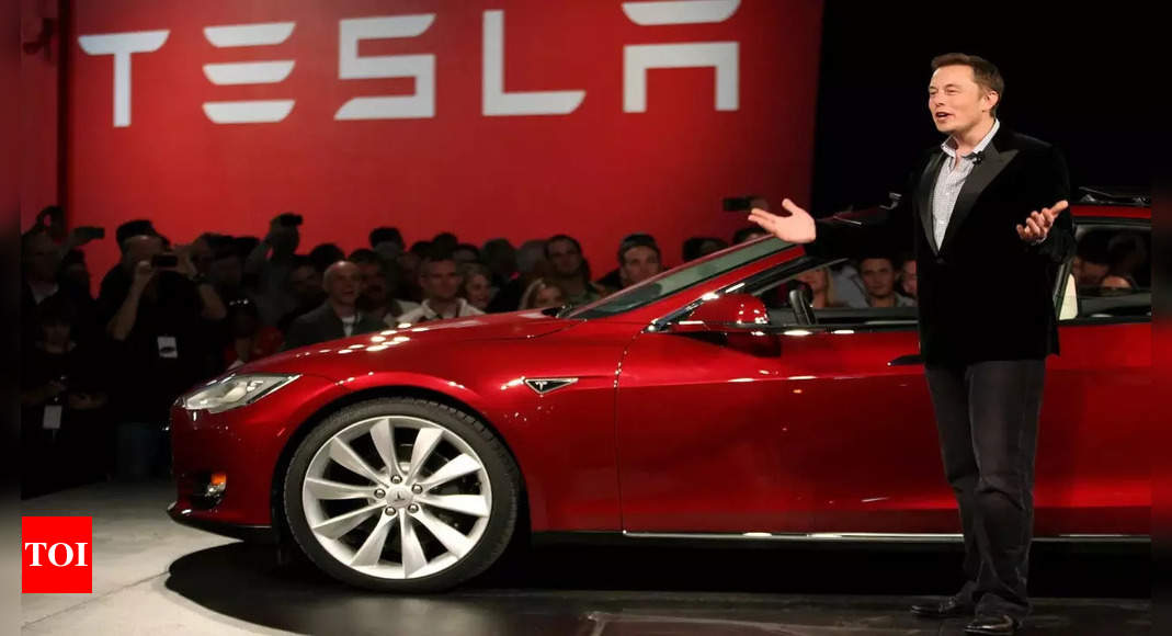 tesla cars may perform rolling stops at traffic lights heres how times of india