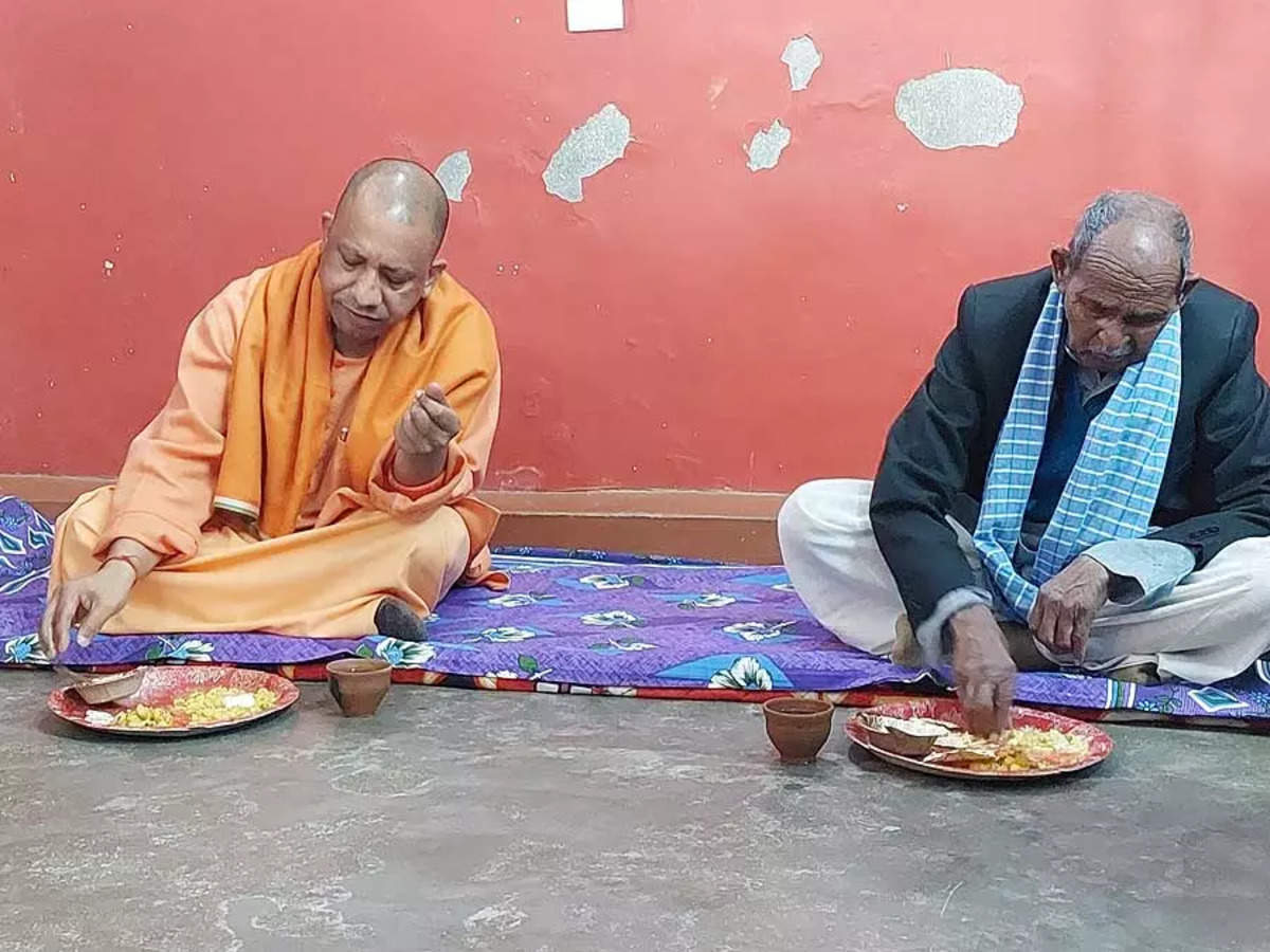 dalit: UP assembly election: Adityanath eats at Dalit household, targets SP  | India News - Times of India
