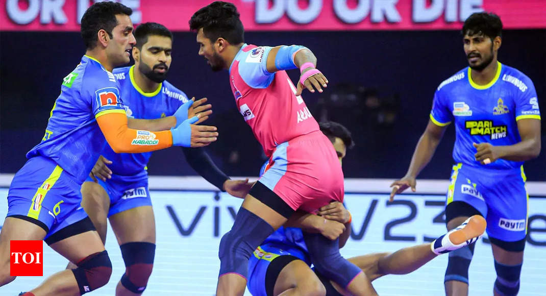 Tamil Thalaivas' K. Prapanjan, in blue and yellow jersey, is pinned down by  players of Patna Pirates during their Vivo Pro Kabaddi league match in  Mumbai, India, Saturday, Aug. 26, 2017. (AP