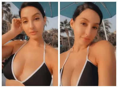 Nora Fatehi takes a dip in pool in black swimsuit, shows off her curves