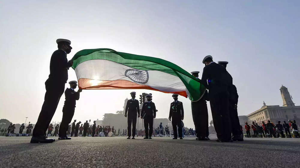 ​Navy personnel hold the Tricolour