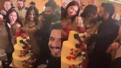 Newlyweds Mouni Roy and Suraj Nambiar's passionate kiss during cake cutting ceremony at their post wedding party steals the show