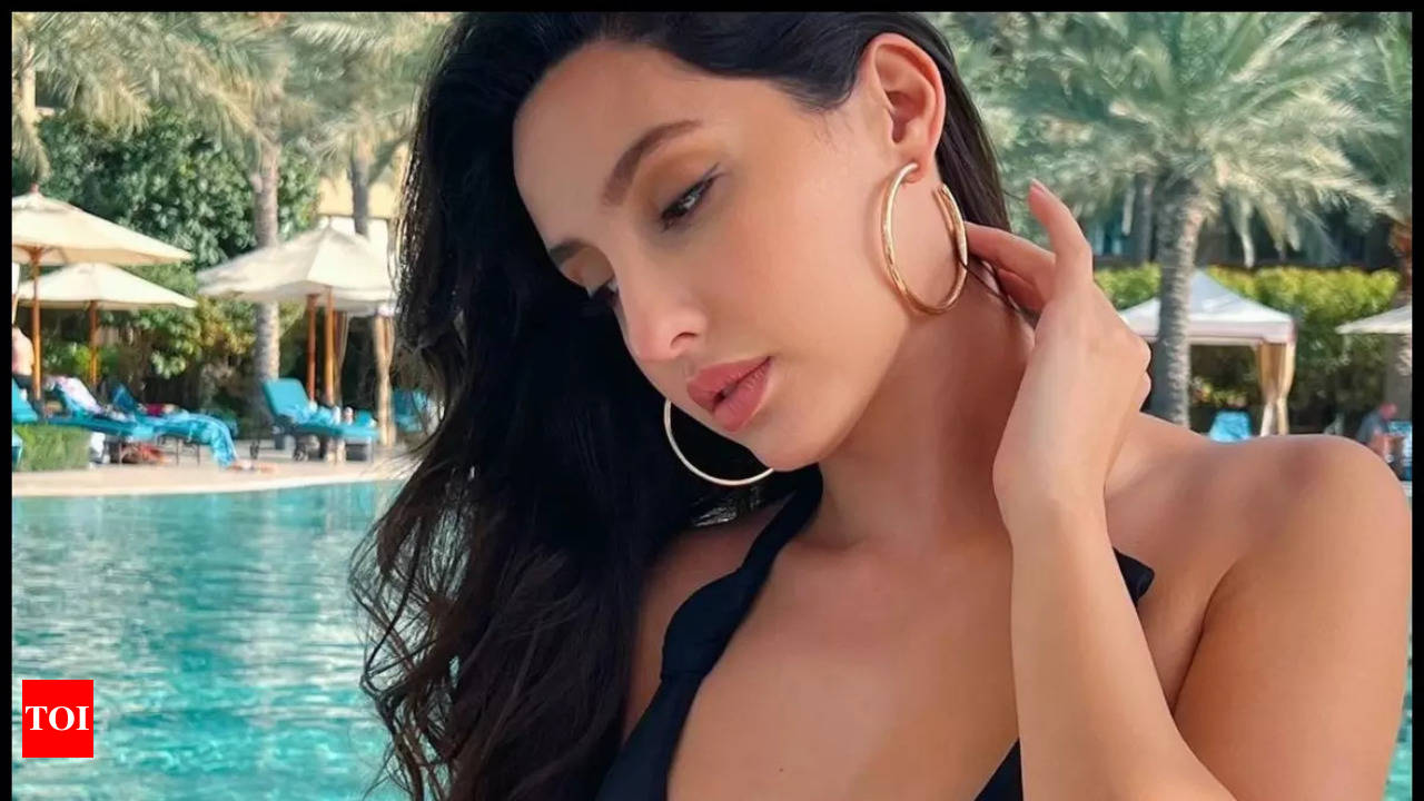 Nora Fatehi steams up the internet as she shares a picture in a black  swimsuit from her Dubai vacay | Hindi Movie News - Times of India