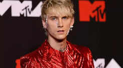 Machine Gun Kelly changes album title after getting it tattooed on Travis Barker