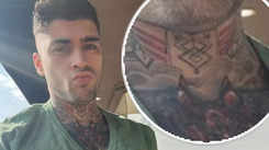 Zayn Malik shows off his symbolic neck tattoo and new clean shave look