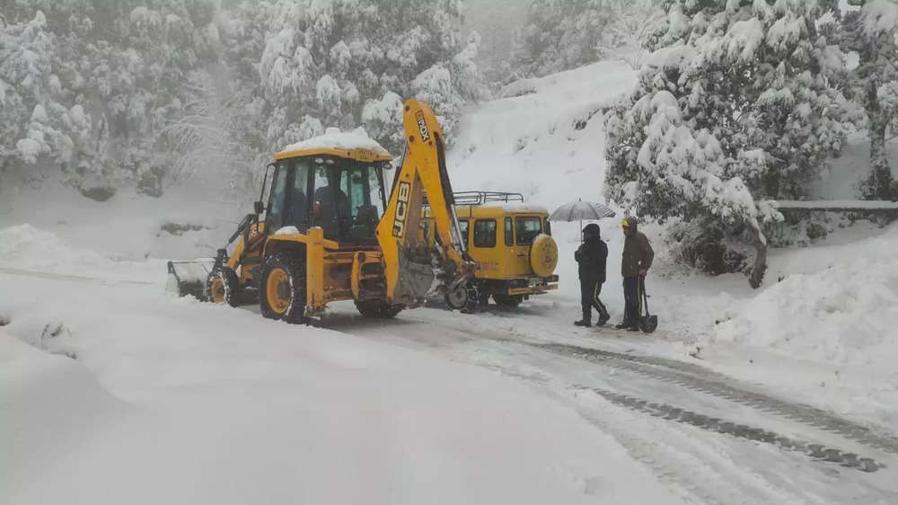 In pics: Heavy snowfall freezes life in hills