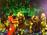 the dance floor looks all lit with guests grooving to the music