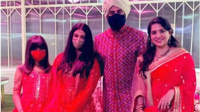 Aishwarya Rai Bachchan, Abhishek Bachchan and Aaradhya strike a pose in red at Anmol Ambani's wedding