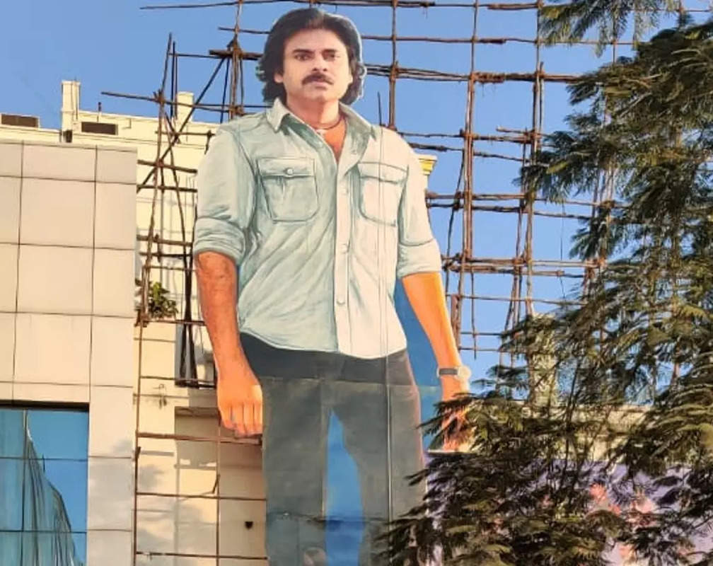 
Pawan Kalyan's fans garland a massive cut-out of the star at a theatre in Hyderabad
