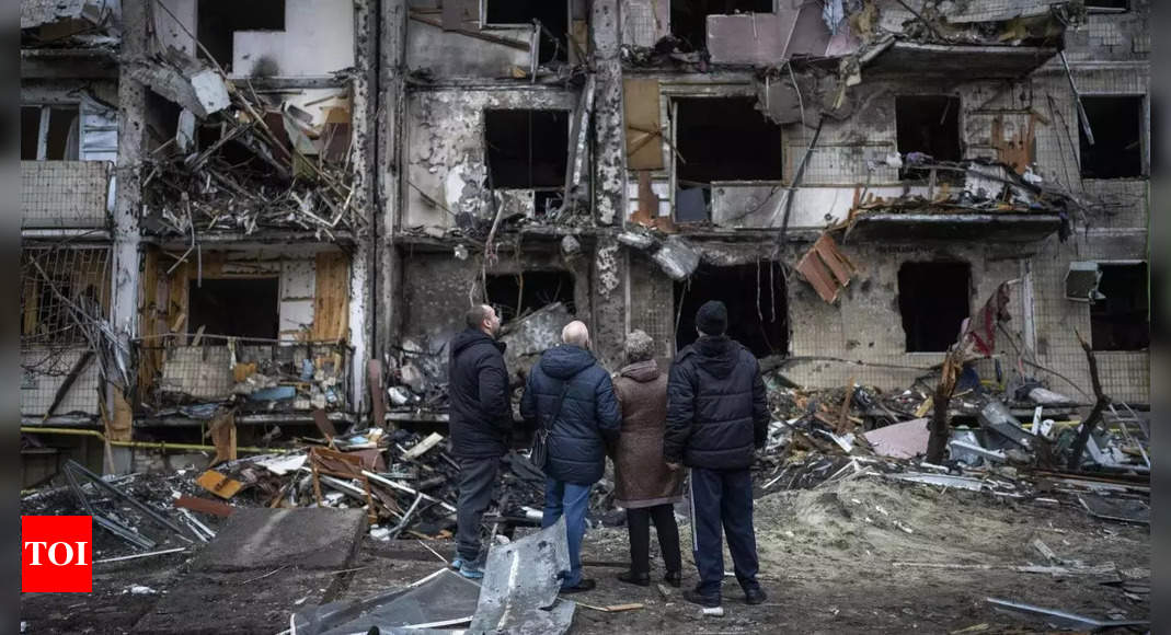 kyiv:  Kyiv residents clear away rubble and await Russian assault – Times of India