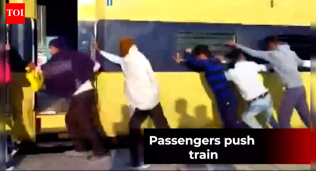 Watch: Passengers push train in a bid to separate coaches from blazing ...