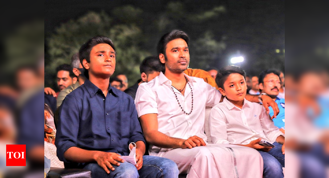 Dhanush makes his first public appearance after separating from Aishwaryaa Rajinikanth; attends concert with sons and sings on stage – watch video – Times of India